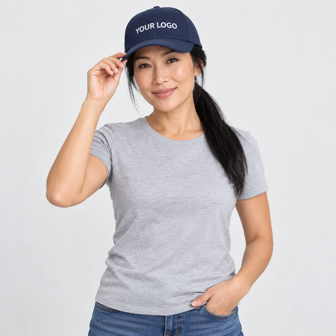 Model wearing a navy cap embroidered with YOUR LOGO