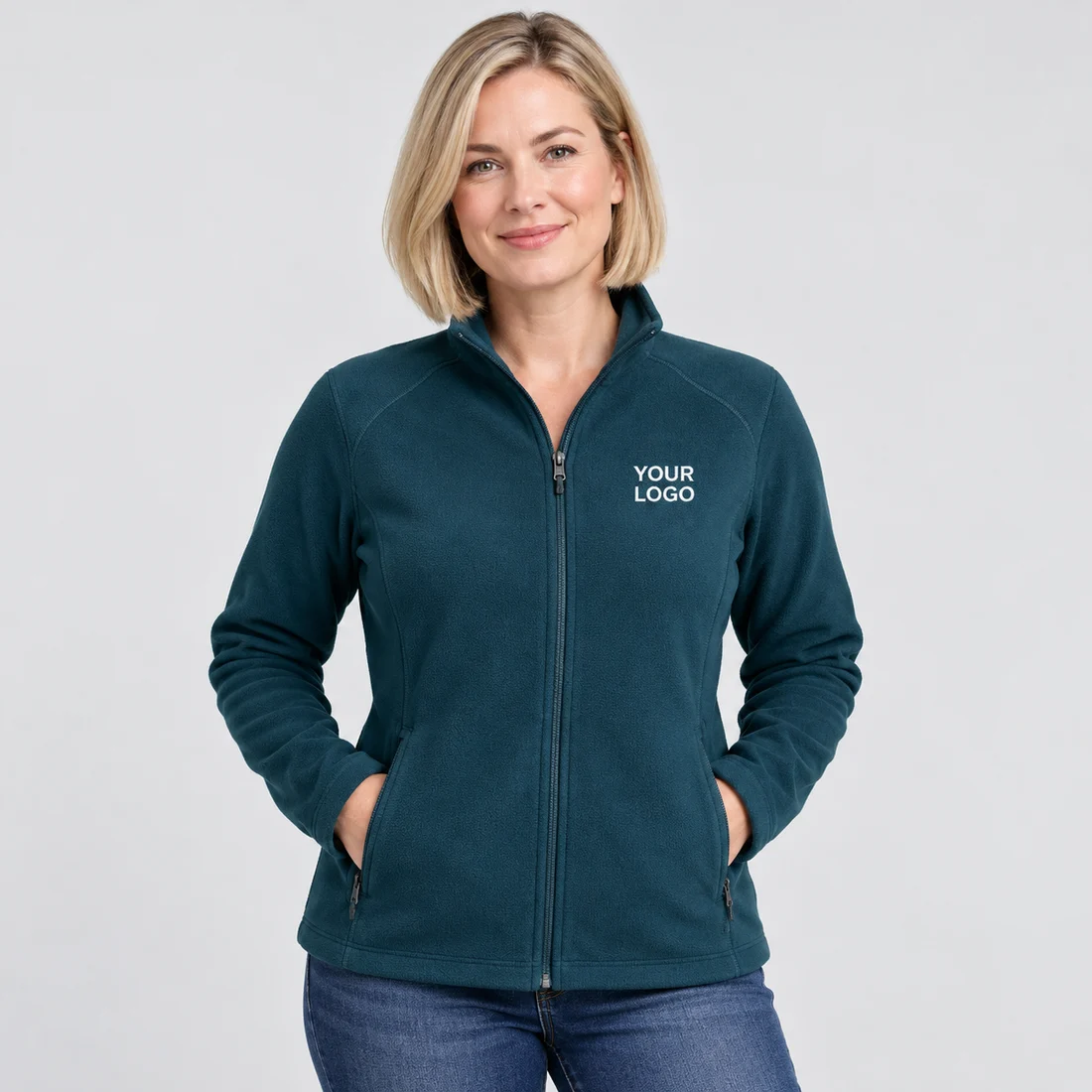 Model wearing a teal jacket embroidered with YOUR LOGO