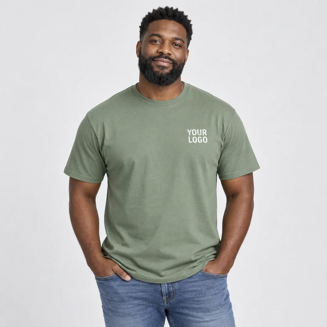 Adult wearing a sage green T-shirt printed with YOUR LOGO