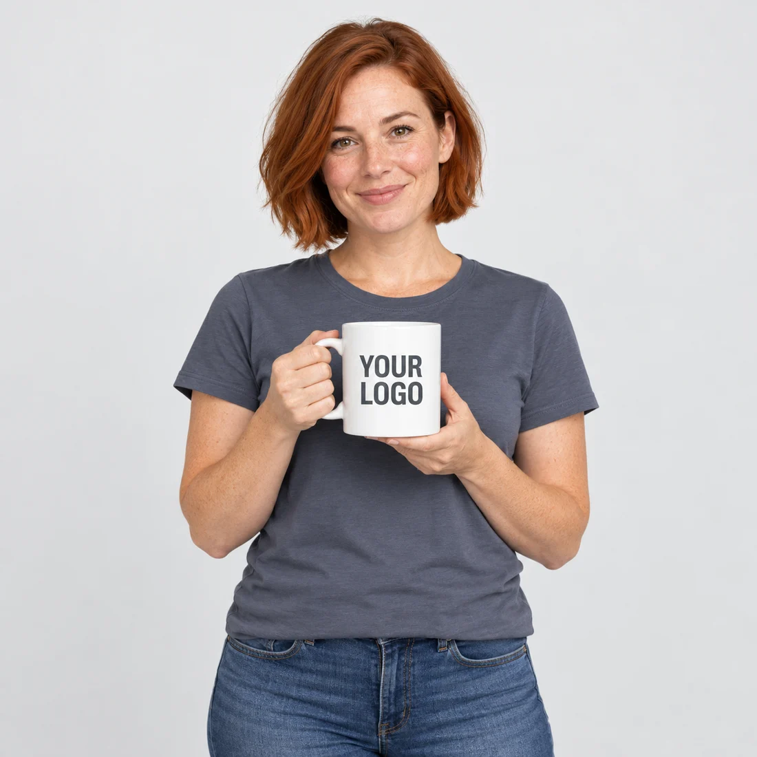 Model holding a white mug printed with YOUR LOGO