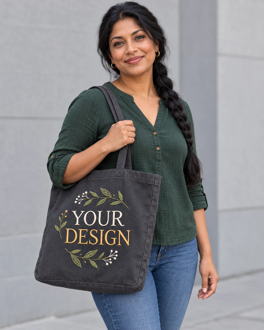 Adult carrying a tote embroidered with YOUR DESIGN and leaves