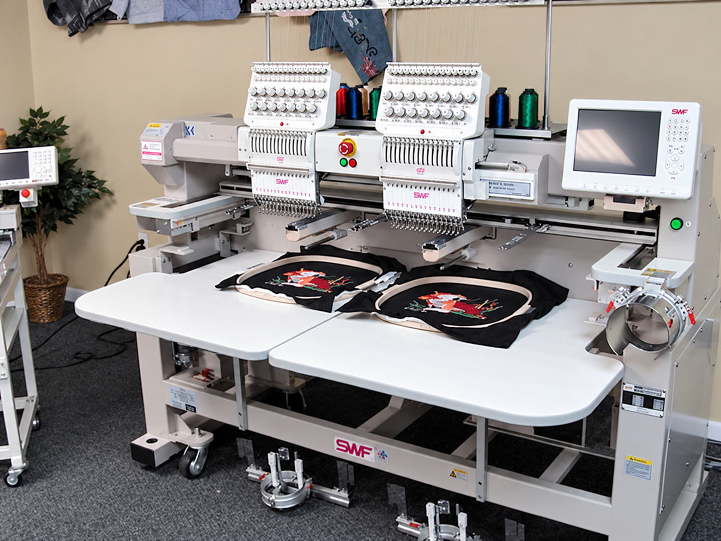 Embroidery equipment and work tables in the JoJo247 workshop