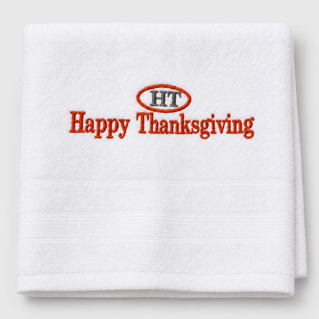 White kitchen towel with red Happy Thanksgiving embroidery