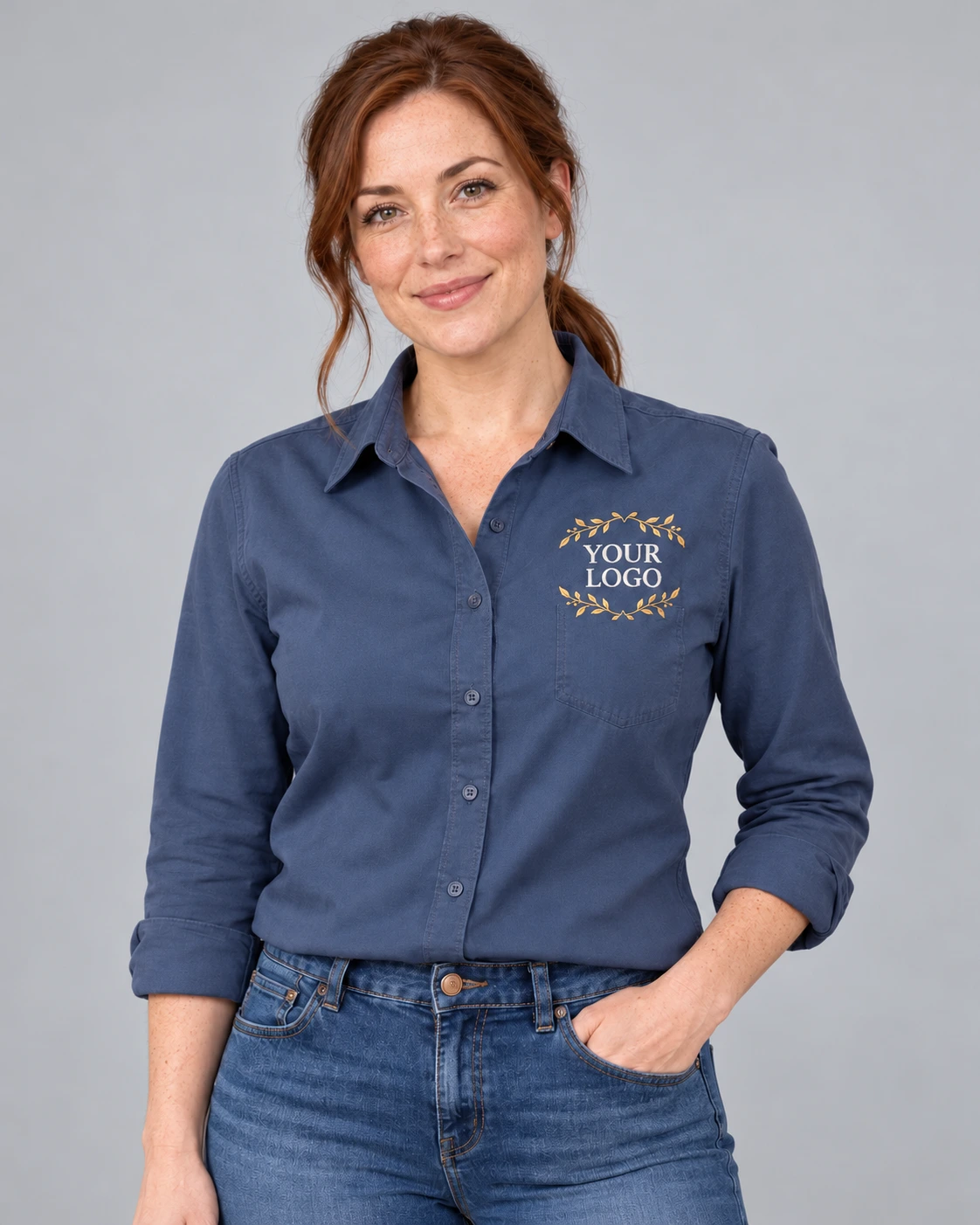 Adult wearing a work shirt with gold laurel YOUR LOGO embroidery